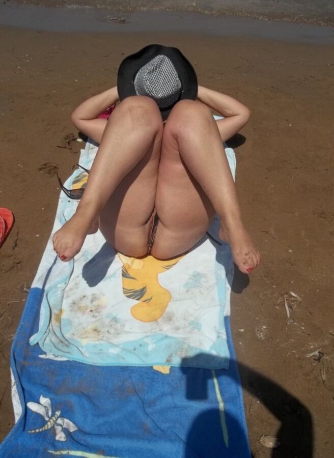 Free porn pics of sunbathing nude on the beach 4 of 6 pics