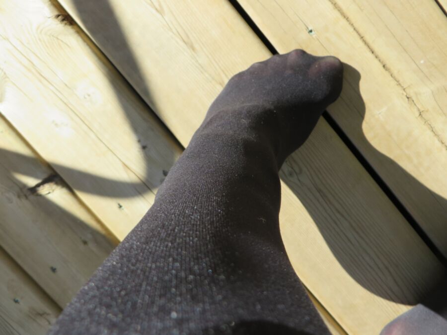 Free porn pics of Black Pantyhose On The Deck 1 of 12 pics