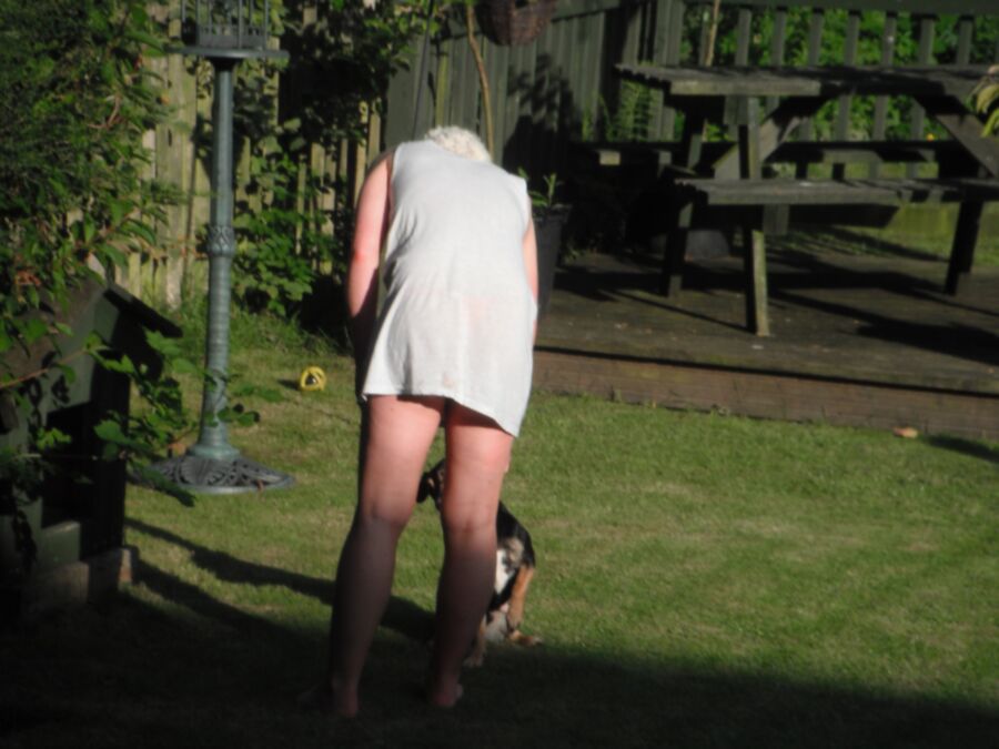 Free porn pics of stepdaughter in garden wearing little vest,no bra and sexy pink  3 of 4 pics