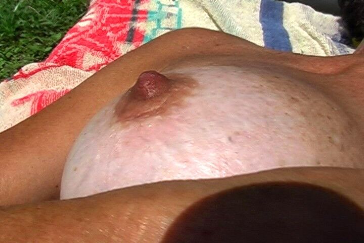 Free porn pics of Sexy mature tits sunbathing 18 of 31 pics