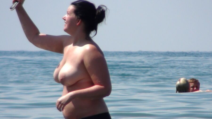 Free porn pics of Topless in sea 4 of 11 pics