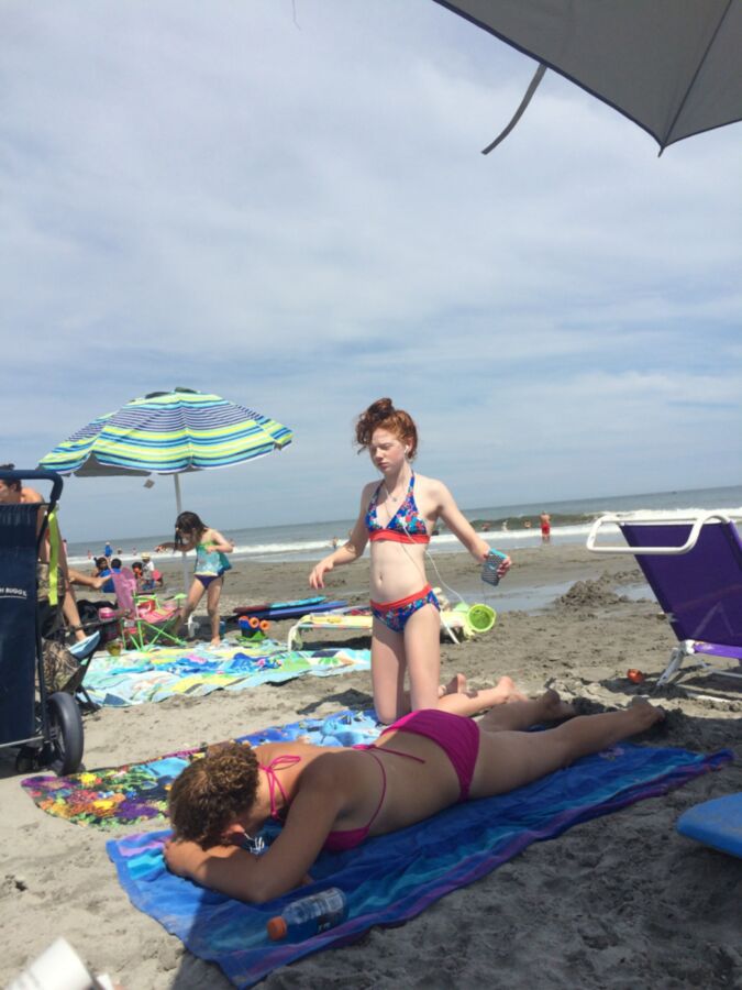 Free porn pics of teen redhead slut on the beach 10 of 14 pics